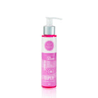 Shampoo Extra Crecimiento tamaño viajero, botella sobre fondo rosa – By Mariana Zapata